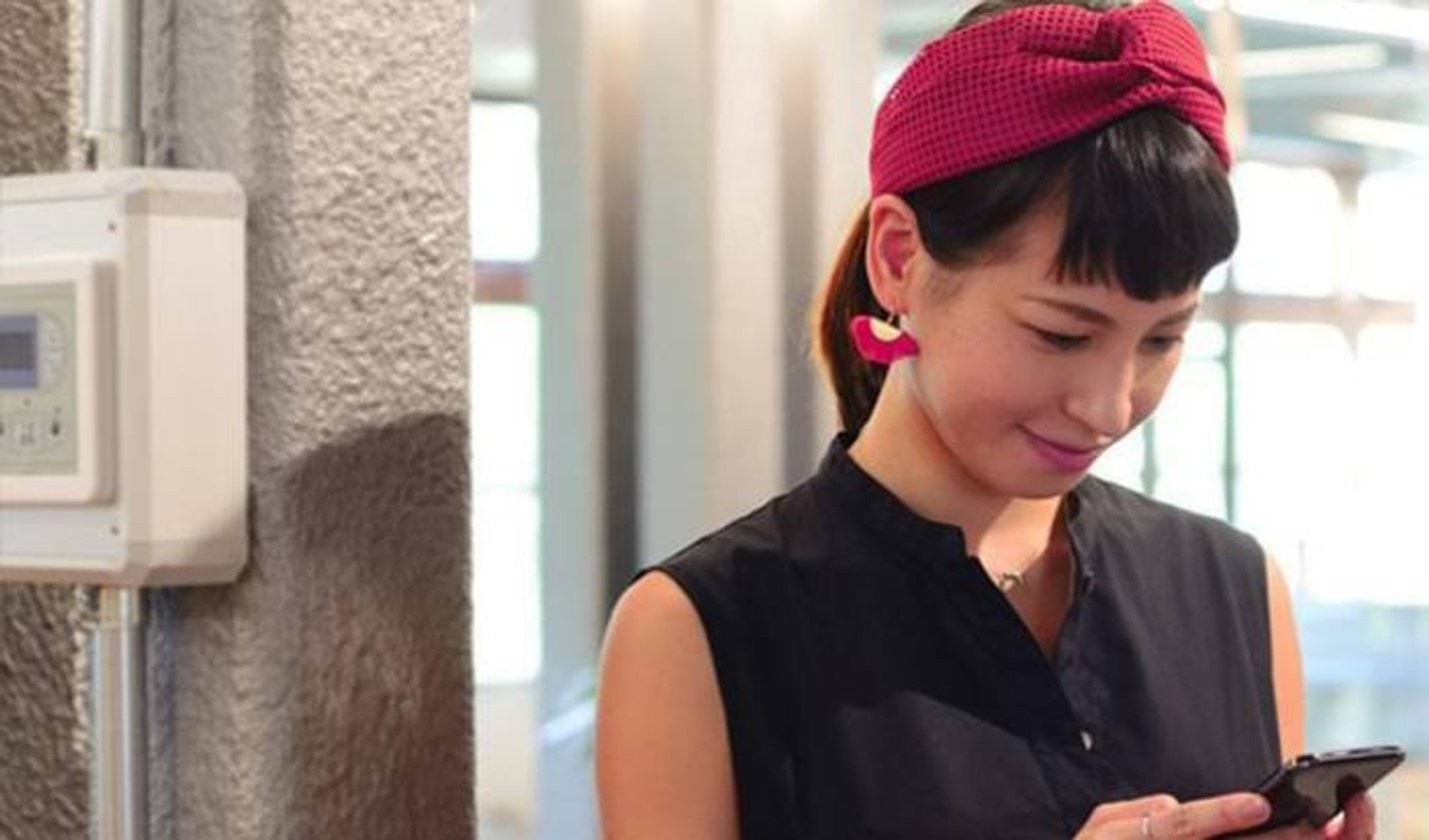 a woman looking at her mobile phone