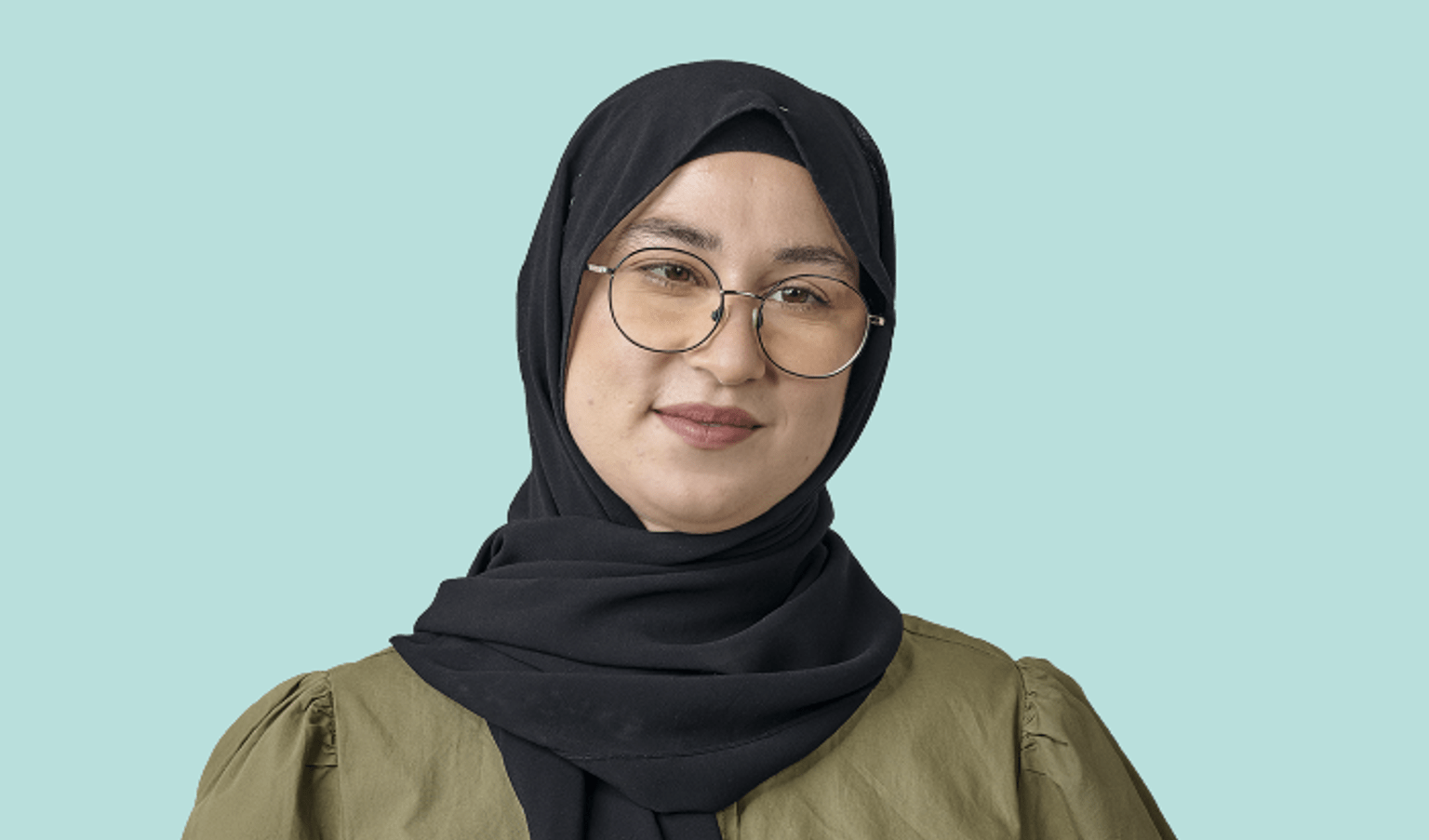 A women smiling. She represent the Women's Health and Wellbeing Program, which is aimed at improving women's health in Victoria.