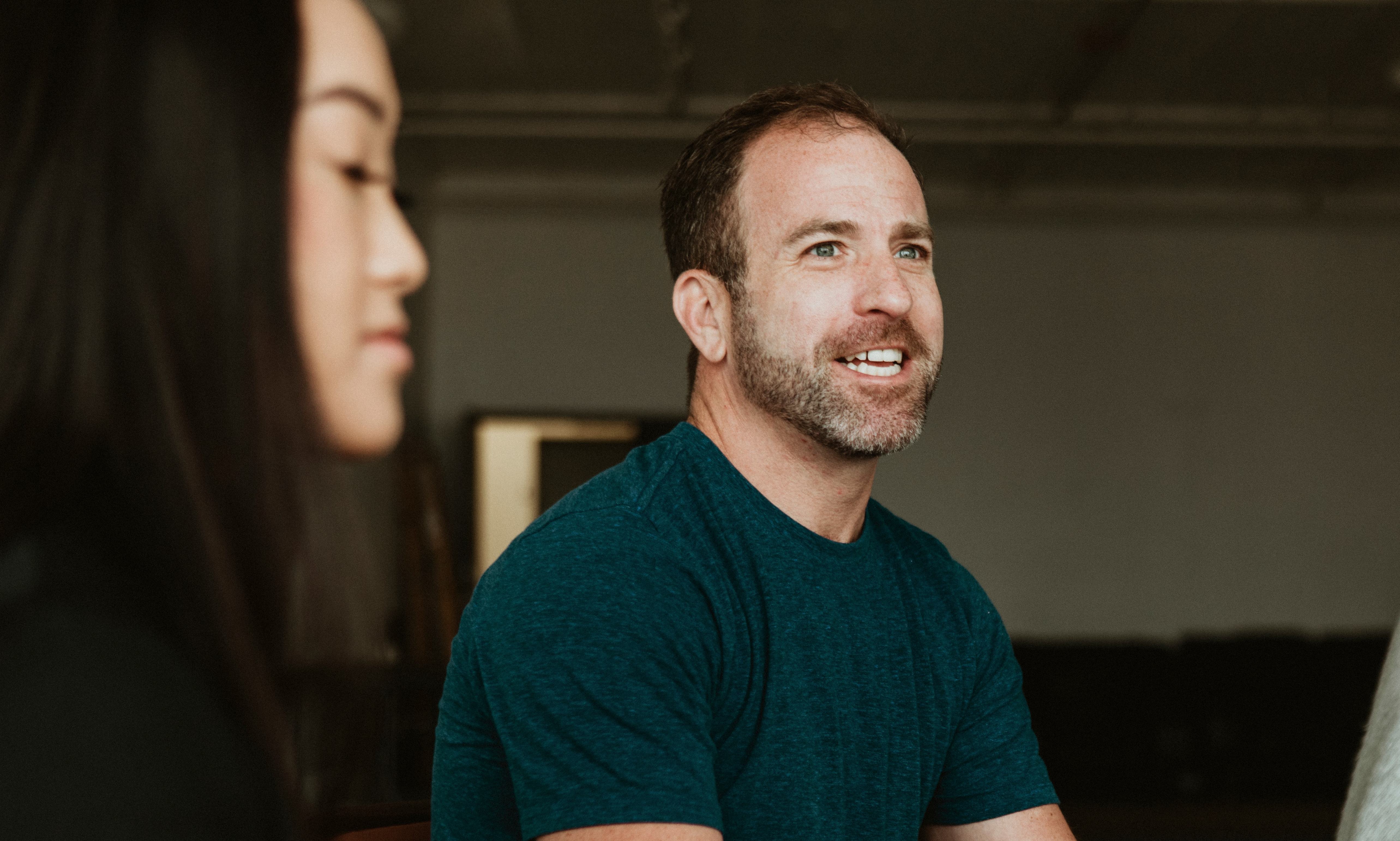 A person talking to a group of people
