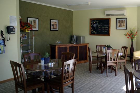 A cafe-style dining area in a dementia-friendly residential aged care facility.